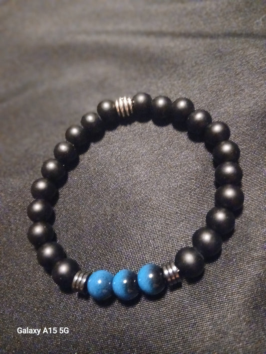 Black onyx beaded bracelet with turquoise accent beads and silver spacers